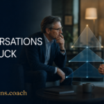 Two professionals in a coaching session discuss a stuck conversation, with a glowing pyramid diagram between them; 'When Conversations Get Stuck' text on dark blue background.