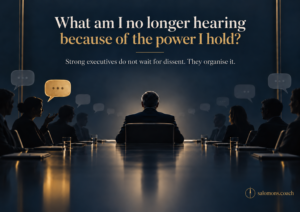 Conference room at night with a leader facing away from the camera; large headline reads, 'What am I no longer hearing because of the power I hold?' and a subheading beneath. Logo bottom right.